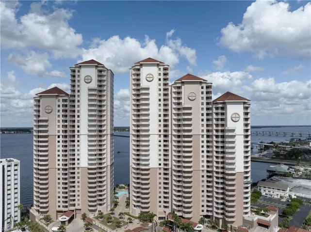 View of property with a water view