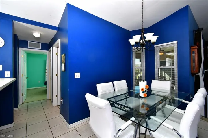 Dining space with a chandelier and light tile patterned floors