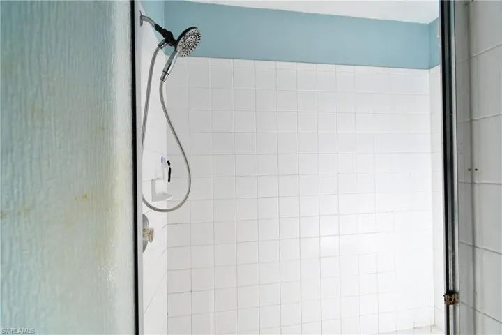 Full bathroom with a stall shower