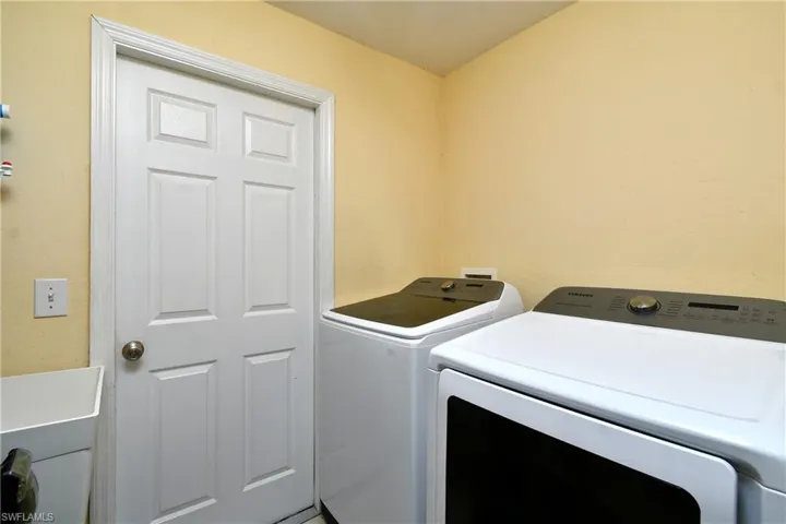 Laundry area featuring separate washer and dryer