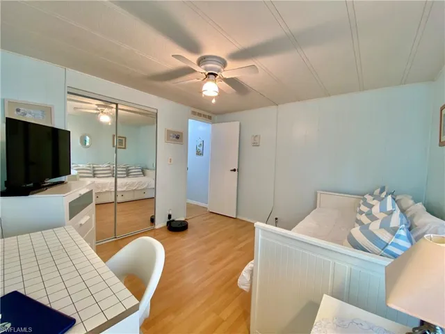 GUEST BED ROOM featuring light wood-type flooring, a closet, and ceiling fan
