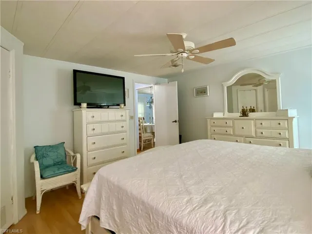 MASTER BEDROOM with wood-type flooring and ceiling fan