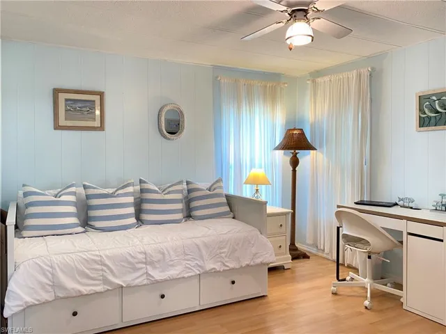 GUEST BED ROOM featuring ceiling fan and light wood-style flooring