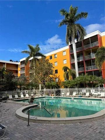 Community pool featuring a patio area