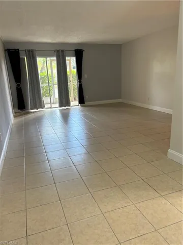 Spare room featuring light tile patterned floors