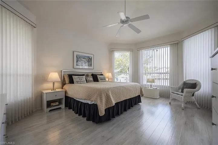 Bedroom with wood finished floors and ceiling fan