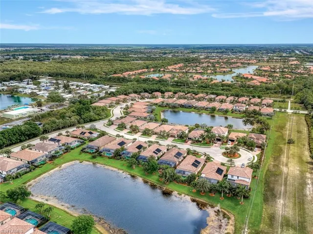 Aerial overview of property's location with nearby suburban area and a large body of water