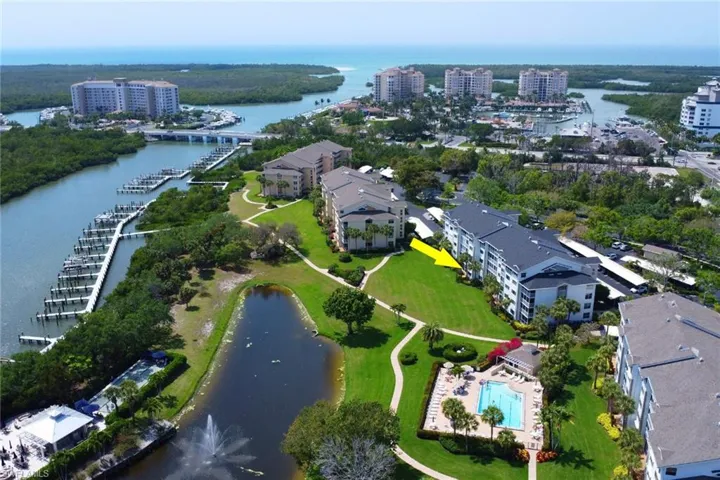 View of property location featuring the bay, nearby urban area, and a pool area