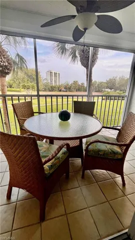 Sunroom / solarium featuring outdoor dining space and a ceiling fan