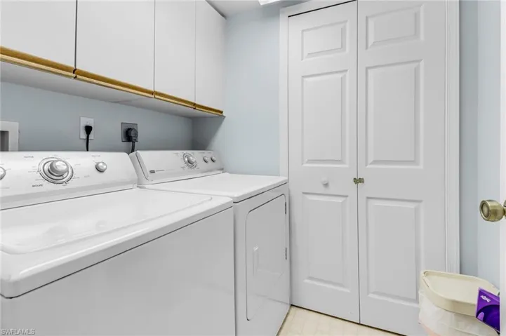 Laundry room featuring cabinet space and washing machine and dryer