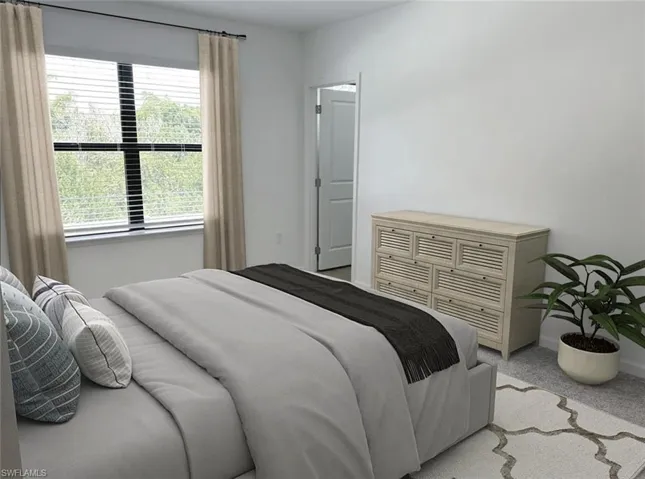 Virtually staged carpeted empty room with baseboards