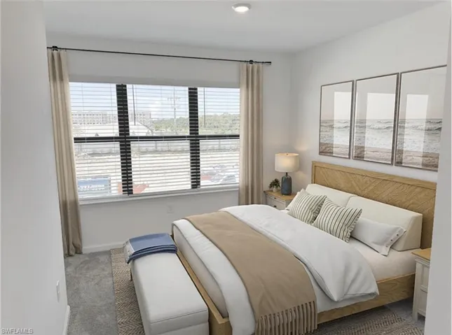 Virtually staged spare room featuring light carpet and baseboards