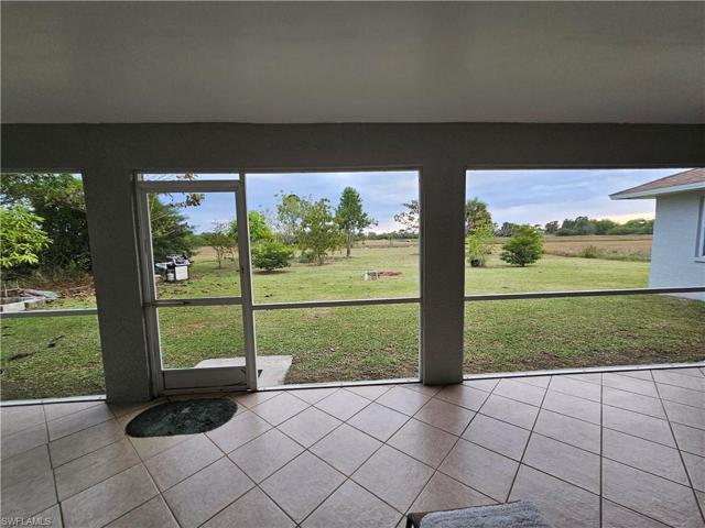 Screened Porch overlooks Greenbelt & Lake
