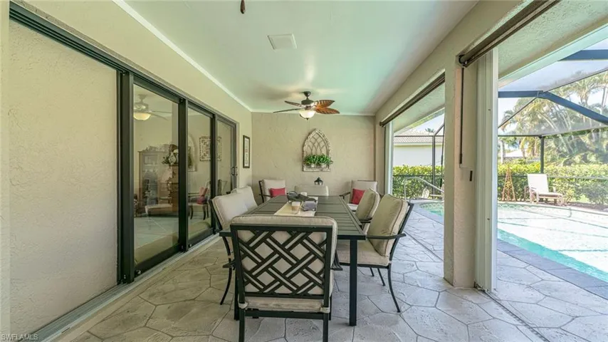Outdoor Living with  Dining space & Ceiling Fan, rolling blinds to provide extra shade