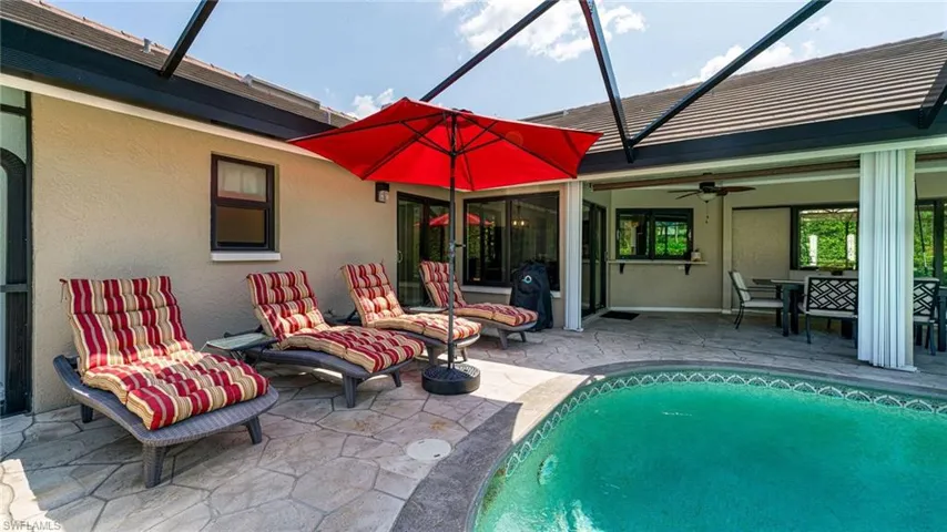 View of pool featuring area to relax & sunbath