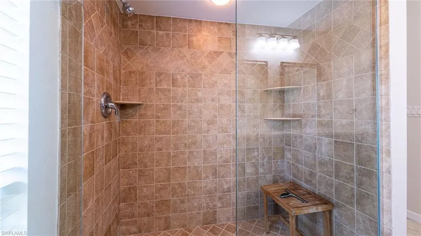 Bathroom with a Large Tile shower with Glass Door Enclosure