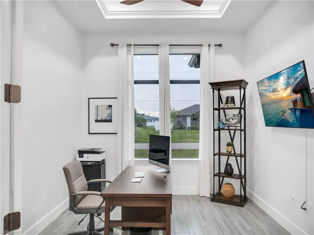Office space featuring light wood-type flooring and ceiling fan