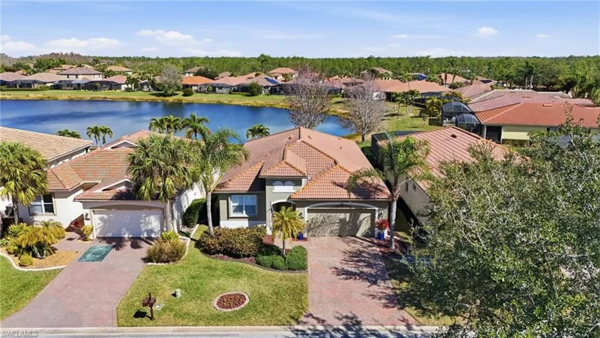 Aerial view of residential area with a nearby body of water
