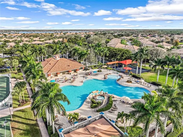 Aerial perspective of suburban area with a pool area