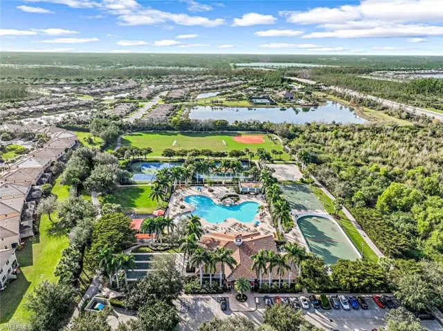 Aerial view of a nearby body of water and a pool area