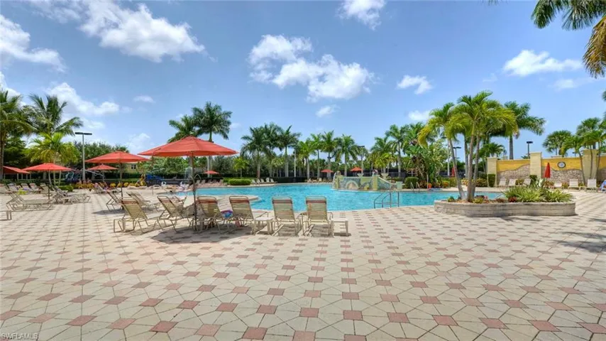 Community pool featuring a patio