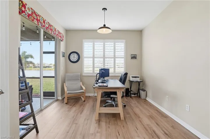 Office featuring light wood-type flooring and baseboards