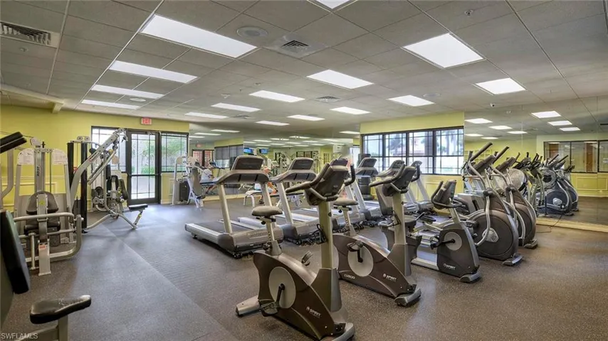 Exercise room featuring a drop ceiling