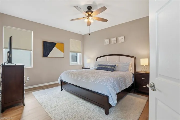 Bedroom featuring light wood-style flooring and ceiling fan