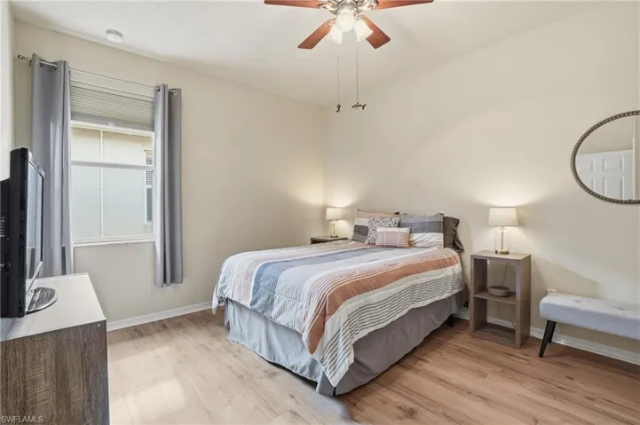 Bedroom with light wood-style flooring and ceiling fan