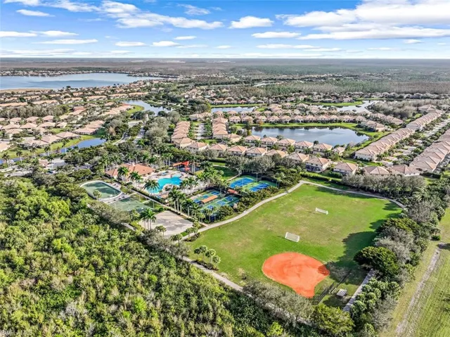 Aerial perspective of suburban area featuring a large body of water