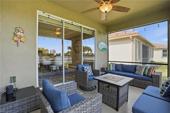 View of patio featuring an outdoor living space and ceiling fan