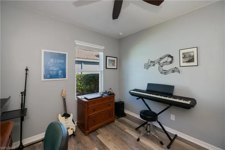 Miscellaneous room featuring ceiling fan and light hardwood / wood-style floors