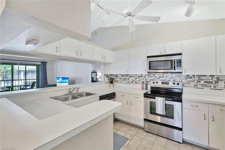 Kitchen with stainless appliances and ample cabinetry.