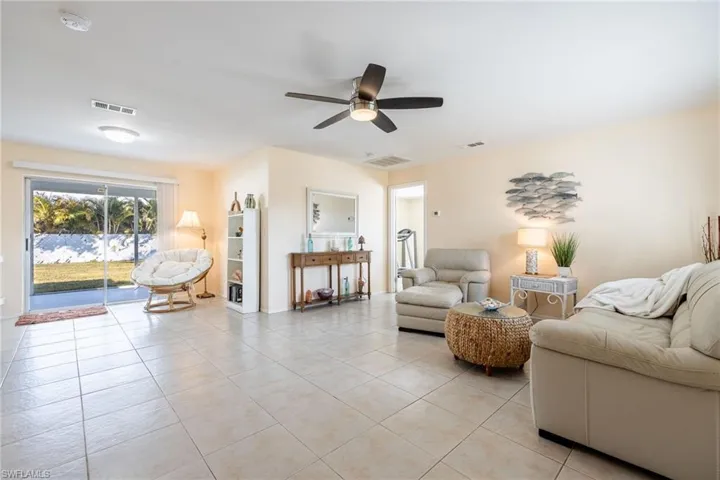 Tiled living room with ceiling fan