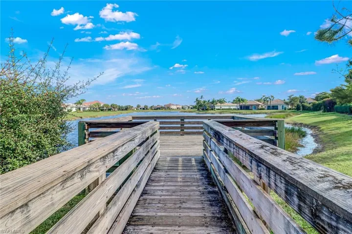 Dock area featuring a water view and a residential view