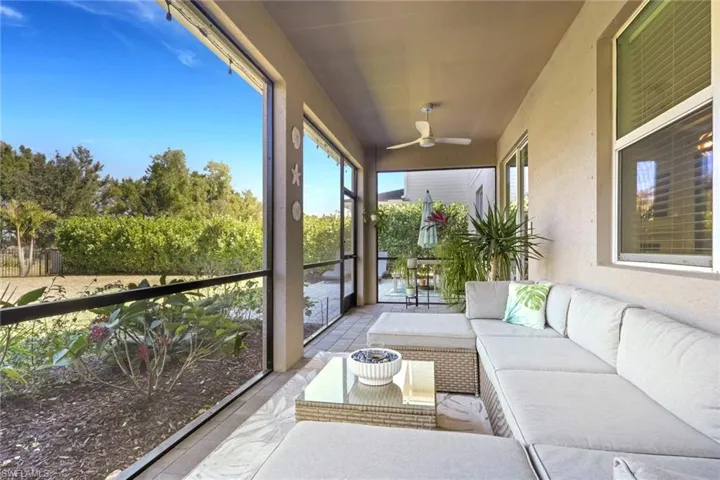 Sunroom featuring an outdoor living space and ceiling fan