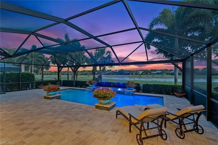 Twilight live shot of pool overlook the fairway at sunset