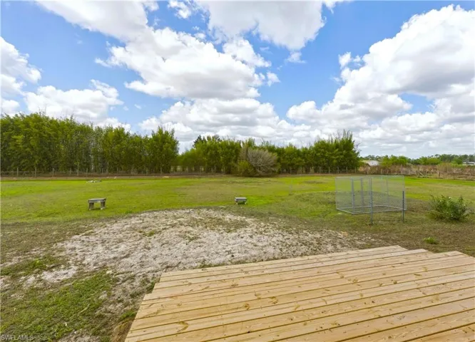 Wooden deck featuring a yard