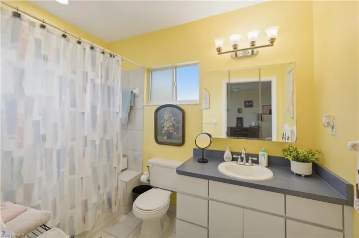 Bathroom with vanity and a shower with curtain