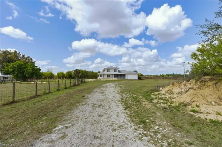 View of dirt / gravel road featuring a view of countryside