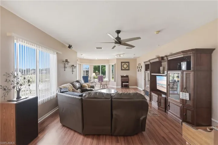 Living area featuring a ceiling fan and wood finished floors