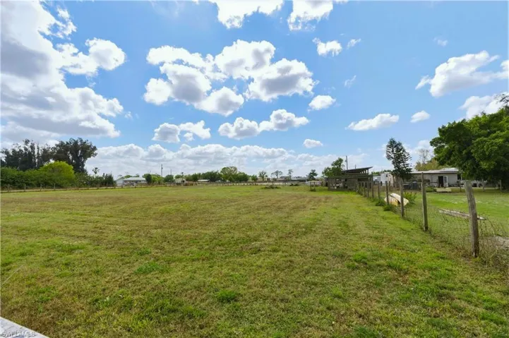View of yard with a rural view
