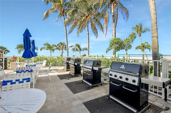 Grill beachfront - this space is perfect for dining and casual gatherings by the shore.