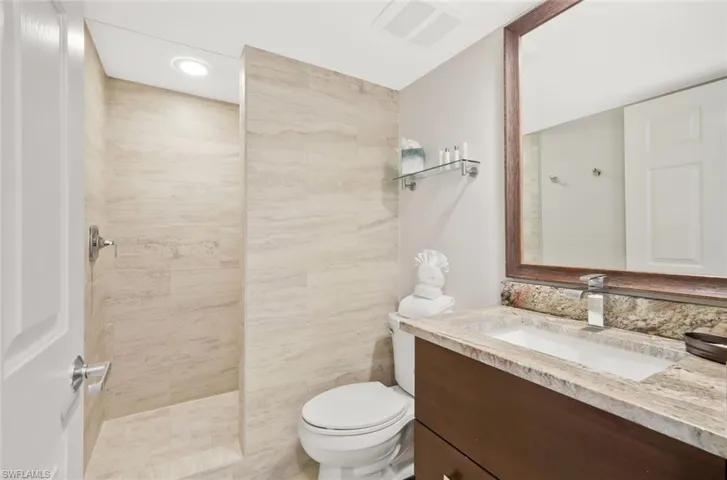 Bathroom features updated fixtures and a large walk in shower.