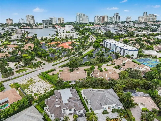 Aerial perspective showcasing a waterfront community with surrounding urban development