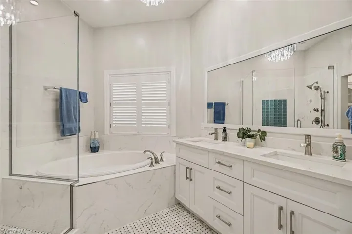 Dual vanity with undermount sinks and coordinating countertops, under sink electrical outlet