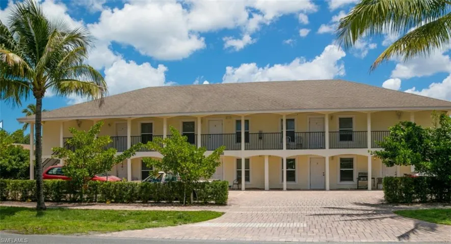 View of property featuring driveway