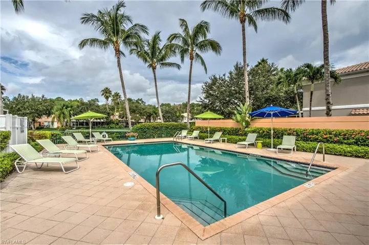 Community pool with a patio area