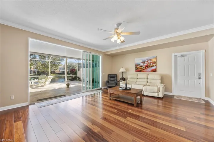 Living room with view of the lanai and lake
