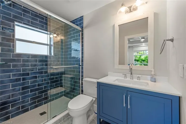 Bathroom with vanity and a shower stall